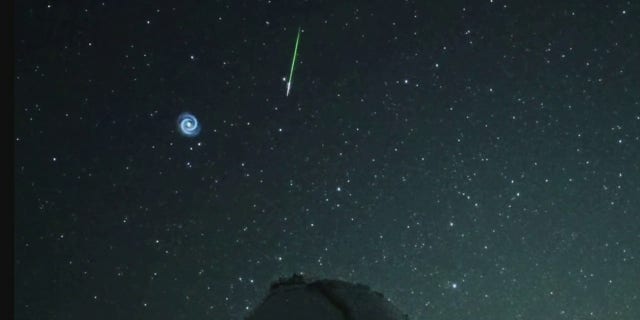 The spiral moved quickly through the sky.