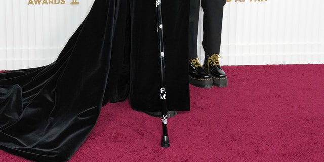 A close-up of Christina Applegate's SAG Awards cane with the message "FU MS."