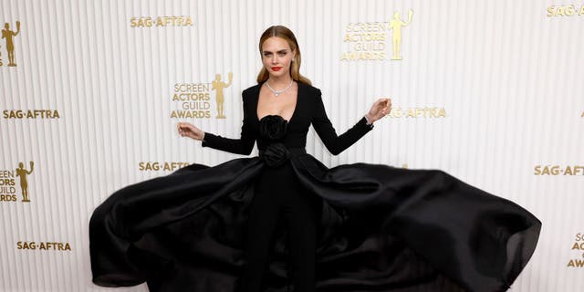 Cara Delevingne showed off her voluminous black dress on the red carpet at the 29th Annual Screen Actors Guild Awards at Fairmont Century Plaza. 