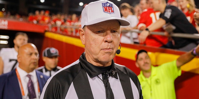 Referee Karl Schaefers, #51, returns to the field after halftime after booing from Kansas City Chiefs fans calls a passer during the second quarter of a game against the Las Vegas Raiders at Arrowhead Stadium on October 10, 2022 in Kansas After.  City, Missouri.