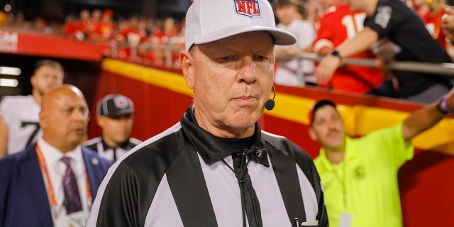 Referee Carl Chefffers, #51, returns to the field after halftime to boos from Kansas City Chiefs fans after a rough call to the passer during the second quarter of a game against the Las Vegas Raiders at Arrowhead Stadium on 10 October 2022 in Kansas.  City, Missouri.