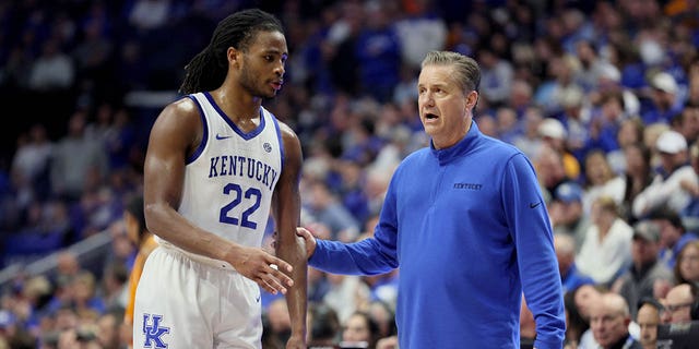 Cason Wallace #22 of the Kentucky Wildcats with John Calipari against the Tennessee Volunteers during the game at Rupp Arena on February 18, 2023 in Lexington, KY.