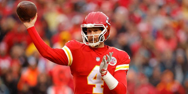 Chad Henne of the Chiefs throws a touchdown pass against the Jacksonville Jaguars in the AFC Divisional playoff game at Arrowhead Stadium on Jan. 21, 2023, in Kansas City, Missouri.