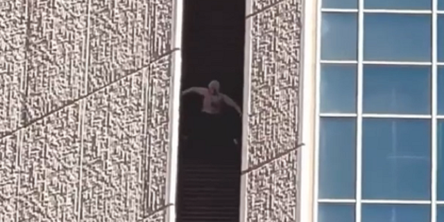 Maison Des Champs is seen scaling the Chase Tower in Phoenix on Tuesday, Feb. 8.