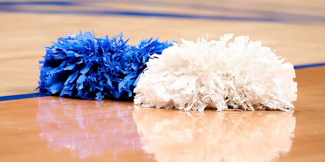 A general view of North Carolina Tar Heels cheerleader pom poms on the court during the first half of the ACC Tournament quarterfinal college basketball game between the North Carolina Tar Heels and the Virginia Cavaliers on March 10, 2022 at the Barclays Center in Brooklyn, New York.