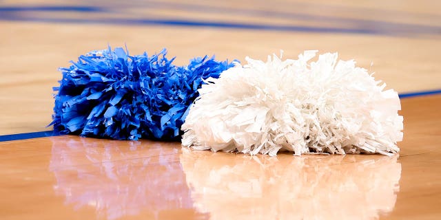 A general view of North Carolina Tar Heels cheerleader pom poms on the court during the first half of the ACC Tournament quarterfinal college basketball game between the North Carolina Tar Heels and the Virginia Cavaliers on March 10, 2022 at the Barclays Center in Brooklyn, New York.