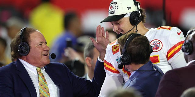 Patrick Mahomes #15 of the Kansas City Chiefs is interviewed by Chris Berman after defeating the Philadelphia Eagles in Super Bowl LVII on February 12, 2023 at State Farm Stadium in Glendale, Arizona.