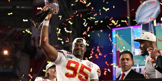 Chris Jones, #95 of the Kansas City Chiefs, celebrates with the Vince Lombardi Trophy after defeating the Philadelphia Eagles 38-35 in Super Bowl LVII at State Farm Stadium on Feb. 12, 2023 in Glendale, Arizona.