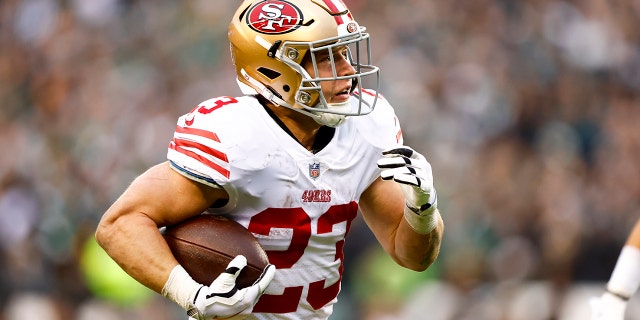 Christian McCaffrey #23 of the San Francisco 49ers carries the ball for a touchdown during the second quarter of the NFC Championship NFL football game against the Philadelphia Eagles at Lincoln Financial Field on January 29, 2023 in Philadelphia, Pennsylvania.