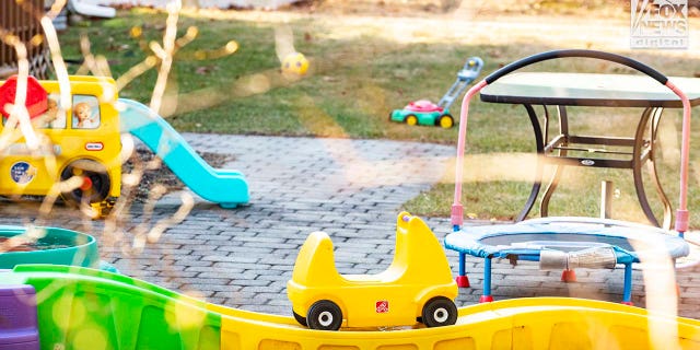 Lindsay Clancy's backyard, filled with children's toys.