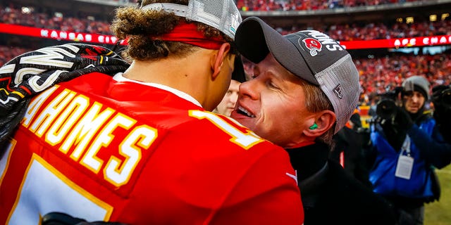 Kansas City Chiefs CEO and President Clark Hunt greets number 15 Patrick Mahomes on the football field during the team's victory celebration over the Tennessee Titans in the AFC Championship game at Arrowhead Stadium on January 19, 2020 in Kansas City, Missouri. 