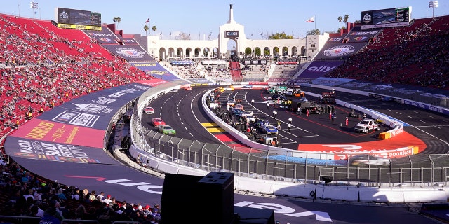 Cars compete during the qualifying portion of the Busch Light Clash NASCAR exhibition car race at the Los Angeles Memorial Coliseum on Sunday, Feb. 5, 2023, in Los Angeles.