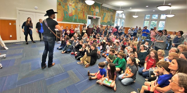 Texas native Coffey Anderson performs in a family-filled room at the Chatham County Public Library in Savannah, Georgia, on Thursday, Feb. 9.