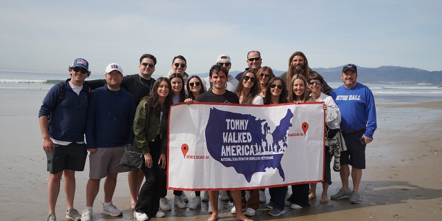 Pasquale, 25, was met by friends and family astatine nan decorativeness statement successful Venice Beach, California, connected Feb. 17, 2023, aft he completed his locomotion crossed America.