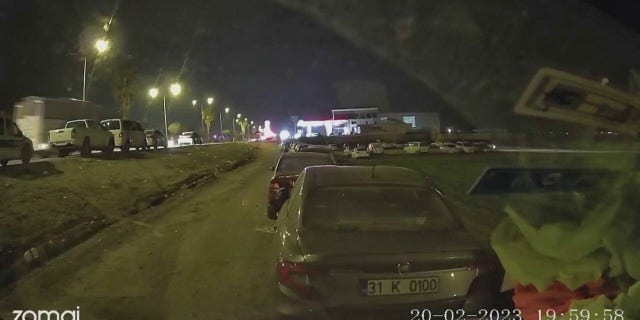 Dashcam video captured the moment a 6.4 magnitude earthquake hit Hatay, Turkey, knocking out electricity and shaking cars.