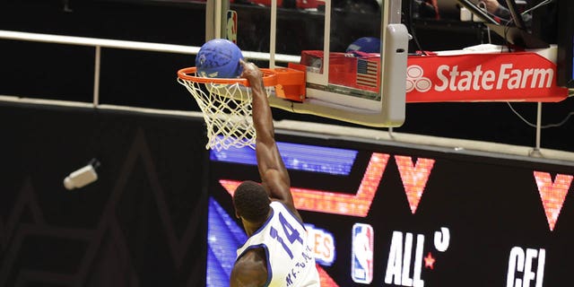 DK Metcalf drives to the basket during Ruffles NBA All-Star Celebrity Game on Friday, Feb. 17, 2023, at the Jon M. Huntsman Center in Salt Lake City, Utah.