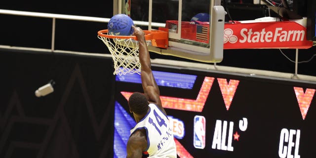 DK Metcalf drives to the basket during the Ruffles NBA All-Star Celebrity Game on Friday, February 17, 2023, at the Jon M. Huntsman Center in Salt Lake City, Utah.