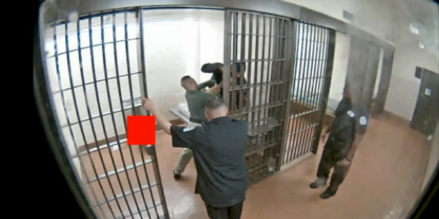 The Chicago police officer is seen striking Damien Stewart inside the cell while he was being restrained.