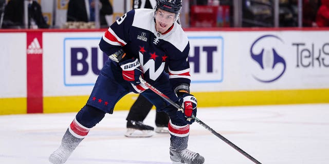 Dmitry Orlov of the Washington Capitals skates with the puck against the San Jose Sharks during the second period of a game at Capital One Arena on February 12, 2023 in Washington, DC