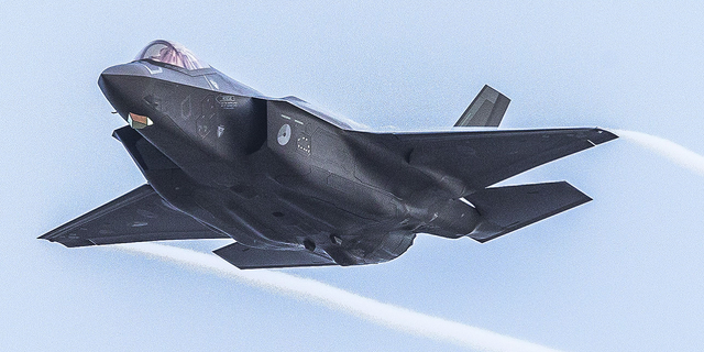 A F-35 of the Royal Netherlands Air Force is shown over a NATO training location on the island of Vlieland in the Netherlands.