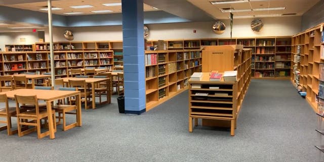 Photo full library shelves after Governor DeSantis signed into law re-evaluating the books allowed in Florida Schools. The photo was posted in contrast to the one posted by fired substitute teacher Brian Covey.