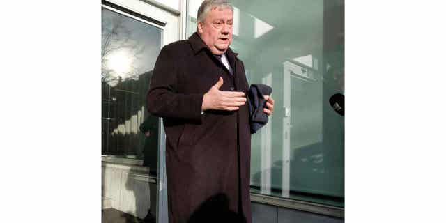 Belgian lawmaker Marc Tarabella speaks with the media in Brussels on Dec. 13, 2022. Tarabella has been detained for questioning in connection with a corruption scandal.