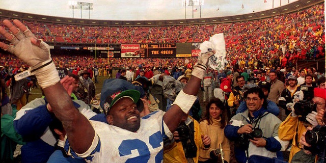 Dallas Cowboys running back Emmitt Smith reacts at Candlestick Park on January 17, 1993, after an NFC Championship Game win against the San Francisco 49ers in San Francisco.
