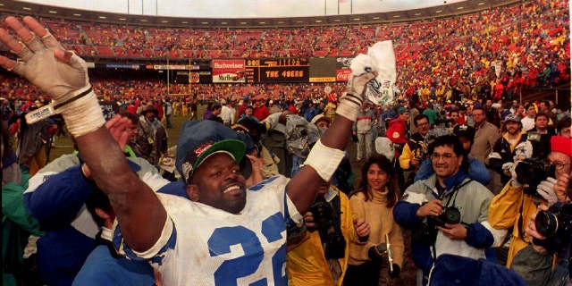 Dallas Cowboys running back Emmitt Smith reacts at Candlestick Park on January 17, 1993, after an NFC Championship Game win against the San Francisco 49ers in San Francisco.