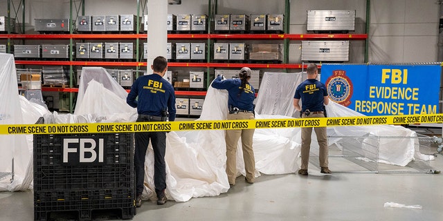 FBI agents process material recovered from the Chinese spy craft recovered off the coast of South Carolina. The material was transported to the FBI Laboratory in Quantico, Virginia.