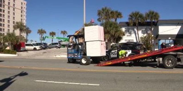 A woman has died after being struck by a forklift in the parking lot of a Florida beachside motel, authorities said.