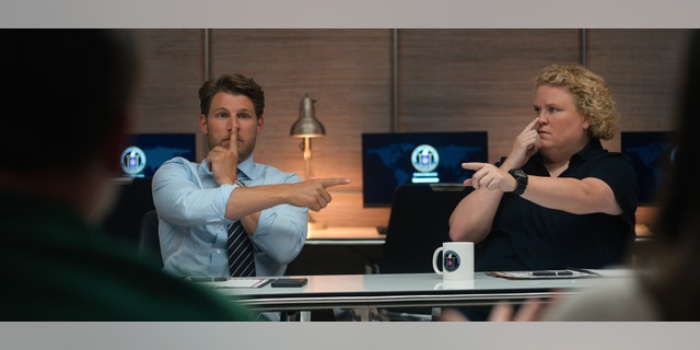 Travis Van Winkle as Aldon Reece, Fortune Feimster as Roo Russell in "FUBAR."