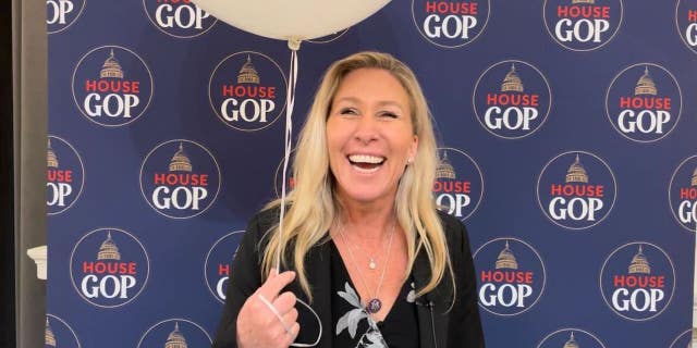 Rep. Marjorie Taylor Greene, R-Ga., poses with a balloon ahead of President Biden's State of the Union address Tuesday.