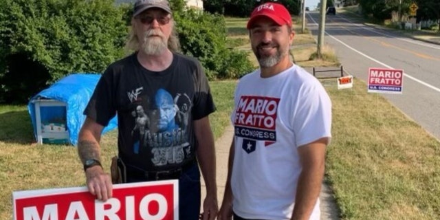 Fratto, who is raising the alarm about free speech on Twitter, stands with a supporter during his congressional campaign.
