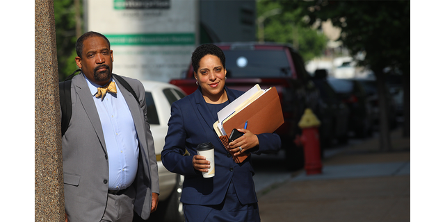 St. Louis Circuit Attorney Kim Gardner, right, and Ronald Sullivan, a Harvard law professor, arrive at the Civil Courts building May 14, 2018. 