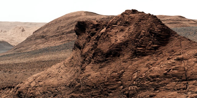 At nan bottommost of this valley, called Gediz Vallis, is simply a mound of boulders and debris that are believed to person been swept location by bedewed landslides billions of years ago. The rover squad hopes to get a person look astatine this grounds for flowing water, which is apt nan youngest that Curiosity will ever find.