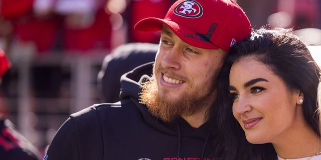 San Francisco 49ers tight end George Kittle (85) poses with his wife, Claire, before a game against the Houston Texans Jan. 2, 2022, at Levi's Stadium in Santa Clara, Calif.