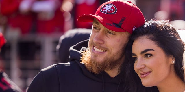 San Francisco 49ers tight end George Kittle (85) poses with his wife, Claire, before a game against the Houston Texans Jan. 2, 2022, at Levi's Stadium in Santa Clara, Calif.