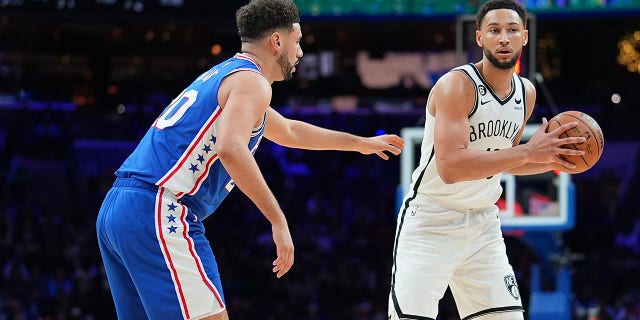 Ben Simmons of the Brooklyn Nets, right, controls the ball against Georges Niang of the Philadelphia 76ers at the Wells Fargo Center Nov. 22, 2022, in Philadelphia.