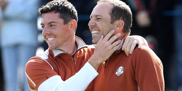 Sergio Garcia, right, and Rory McIlroy celebrate victory during the morning fourball matches of the 2018 Ryder Cup at Le Golf National on Sept. 29, 2018 in Paris.