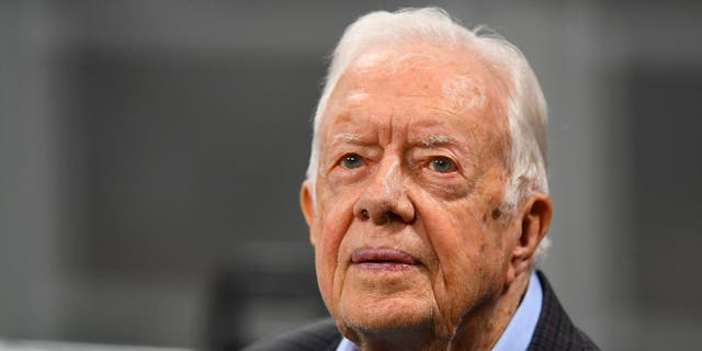 Former president Jimmy Carter prior to the game between the Atlanta Falcons and the Cincinnati Bengals at Mercedes-Benz Stadium on September 30, 2018 in Atlanta, Georgia.