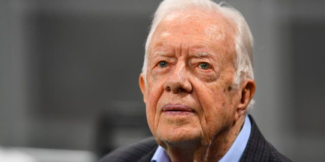 Former president Jimmy Carter prior to the game between the Atlanta Falcons and the Cincinnati Bengals at Mercedes-Benz Stadium on September 30, 2018 in Atlanta, Georgia.