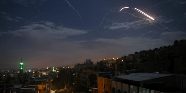 File: A picture taken early on January 21, 2019 shows Syrian air defense batteries responding to what Syrian state media said were Israeli missiles targeting Damascus. - (Photo: STR/AFP via Getty Images)