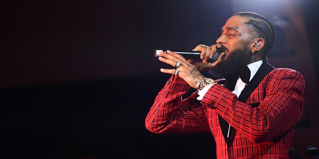 Nipsey Hussle performs onstage at the Warner Music Pre-Grammy Party at the NoMad Hotel on February 7, 2019, in Los Angeles, California.  