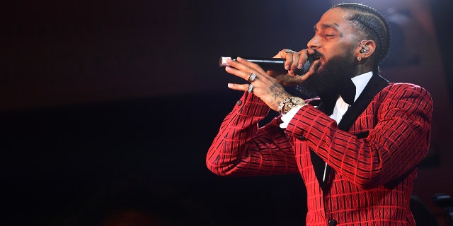 Nipsey Hussle performs onstage at the Warner Music Pre-Grammy Party at the NoMad Hotel on February 7, 2019, in Los Angeles, California.  