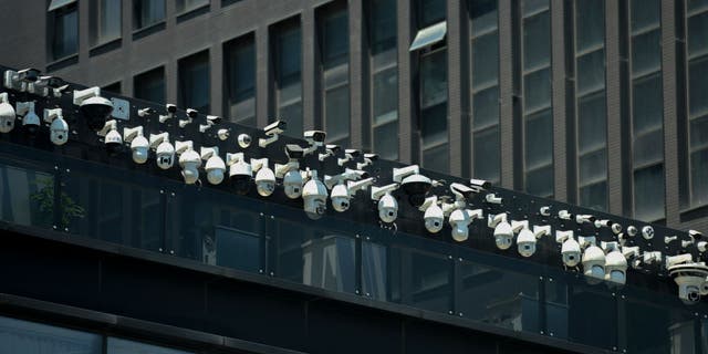 Surveillance cameras being installed on the Dahua Technologies office building in Hangzhou, in China's Zhejiang province on May 29, 2019.