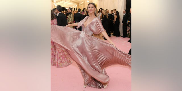 Gisele Bündchen, pictured at the Met Gala, is usually identifiable, often embodying an effortless look.