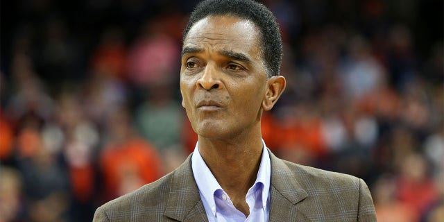 Ralph Sampson accompanies Braxton Key, #2 of the Virginia Cavaliers, during a senior day ceremony before the start of a game against the Louisville Cardinals at John Paul Jones Arena on March 7, 2020 in Charlottesville, Virginia.