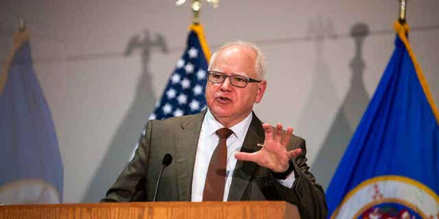 Minnesota Governor Tim Walz speaks during a press conference on April 19, 2021, in St. Paul, Minnesota. The state's budget surplus is projected to reach 17.5 billion. Walz's budget proposal includes a combination of spending increases and tax credits to return the surplus to taxpayers.