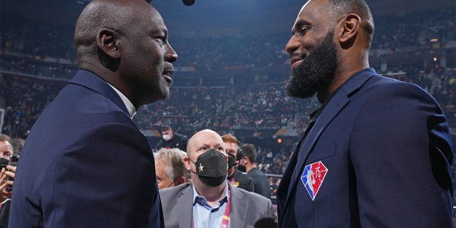 NBA Legends Michael Jordan and LeBron James shake hands during the 2022 NBA All-Star Game Feb. 20, 2022, at Rocket Mortgage FieldHouse in Cleveland.