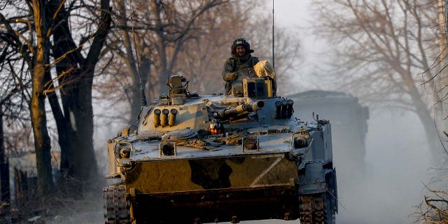Russian military vehicles patrol in Volnovakha city, one of the cities most affected by the war between Russia and Ukraine that started on February 24, in the Donetsk region of Ukraine, on March 27, 2022.